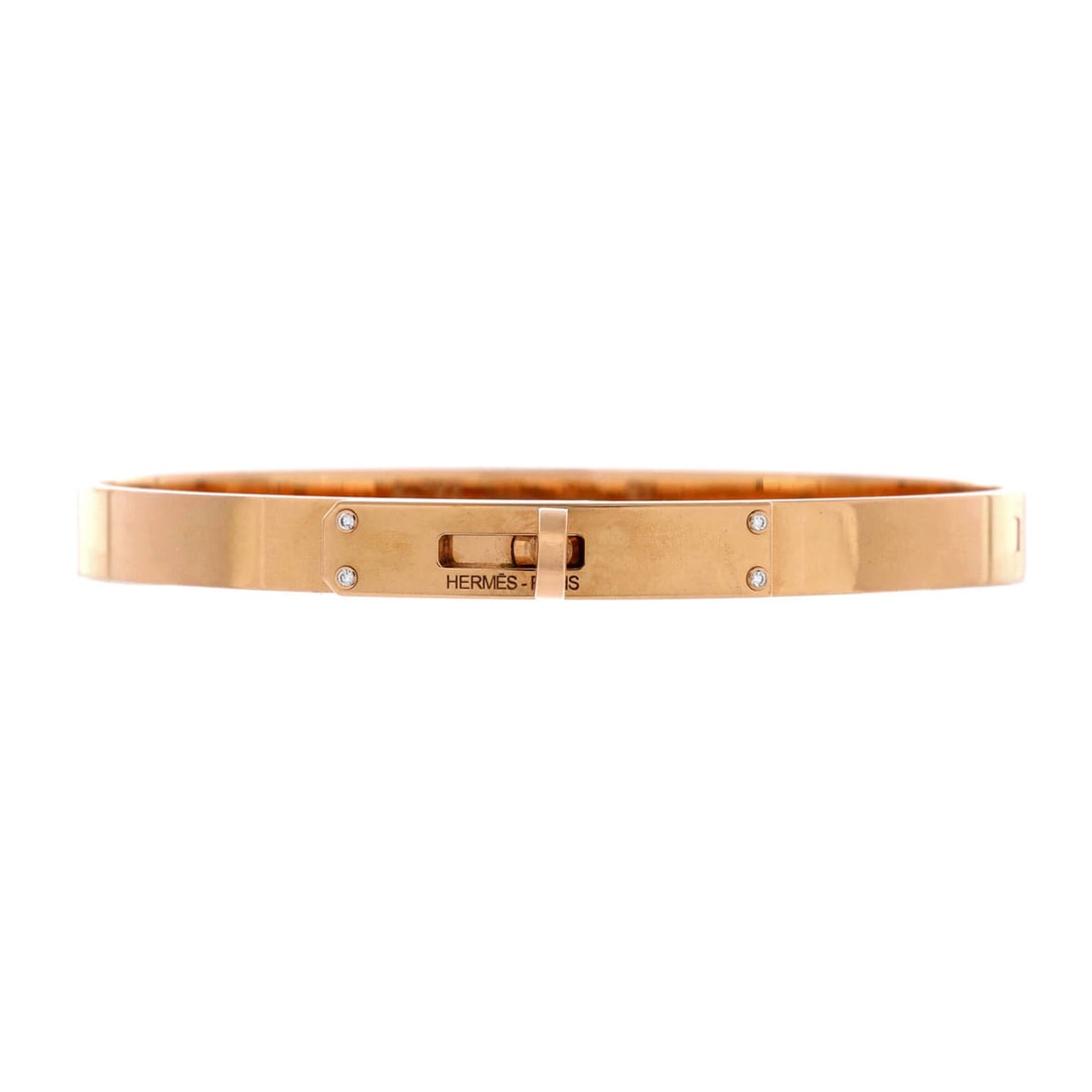 Hermes Kelly Bracelet 18K Rose Gold with 4 Diamonds Small: The Hermes Kelly Bracelet brings the house's signature to the body with disciplined, polished form, set with diamonds. Its weight and scale feel considered, the kind of balance that reads as quietly e