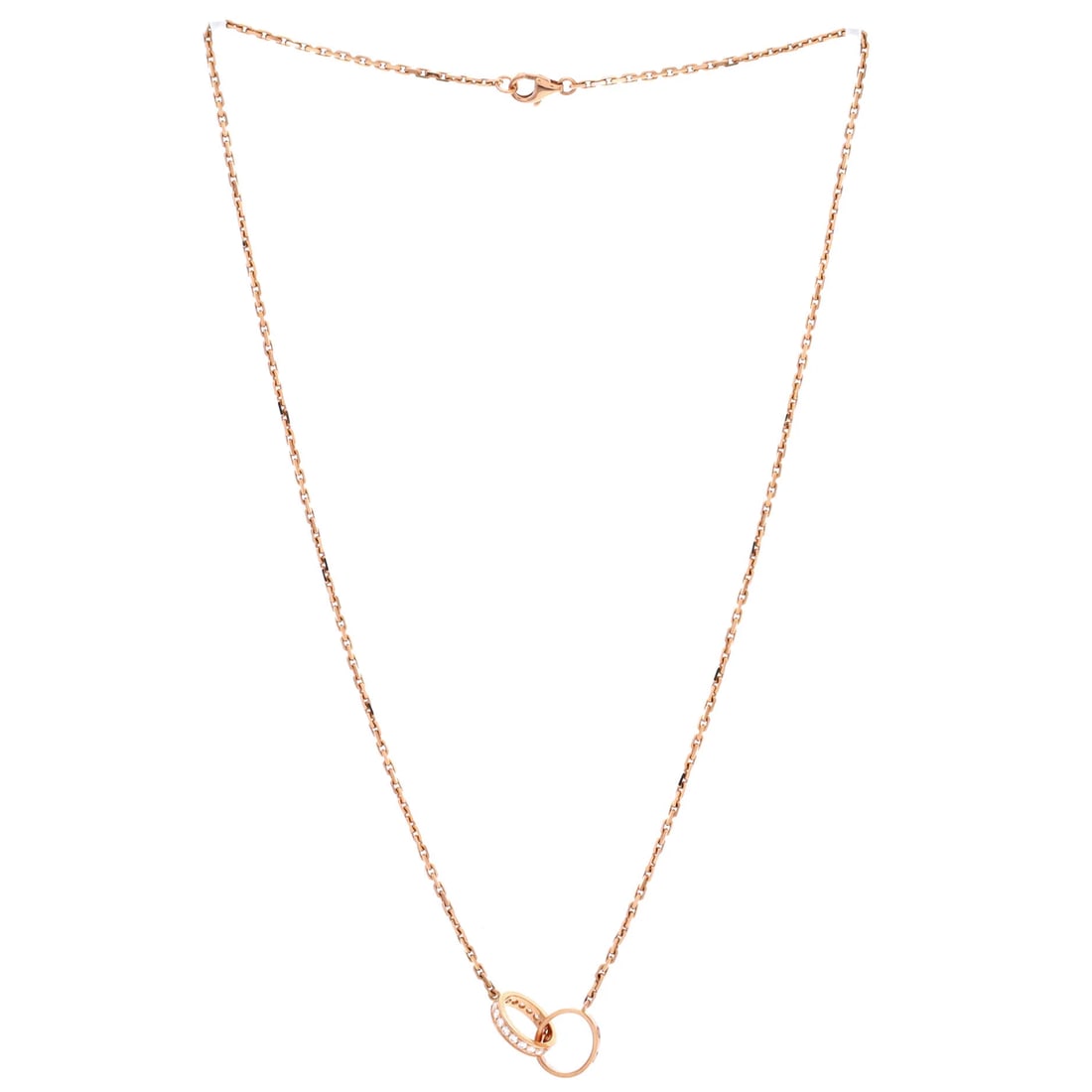 Cartier Love Interlocking Necklace 18K Rose Gold with Diamonds: From Cartier, the Love Interlocking Necklace carries a recognizable motif rendered with quiet precision, set with diamonds. Its weight and scale feel considered, the kind of balance that reads as quie