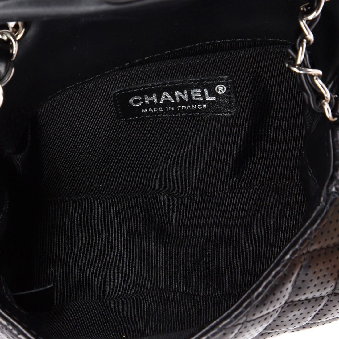 Chanel Filigree Flap Bag Quilted Tweed Small: The Chanel Filigree Flap Bag announces itself through clean architecture and a silhouette that reads clearly from across a room, rendered in quilted tweed. The Small format strikes a versatile middle 