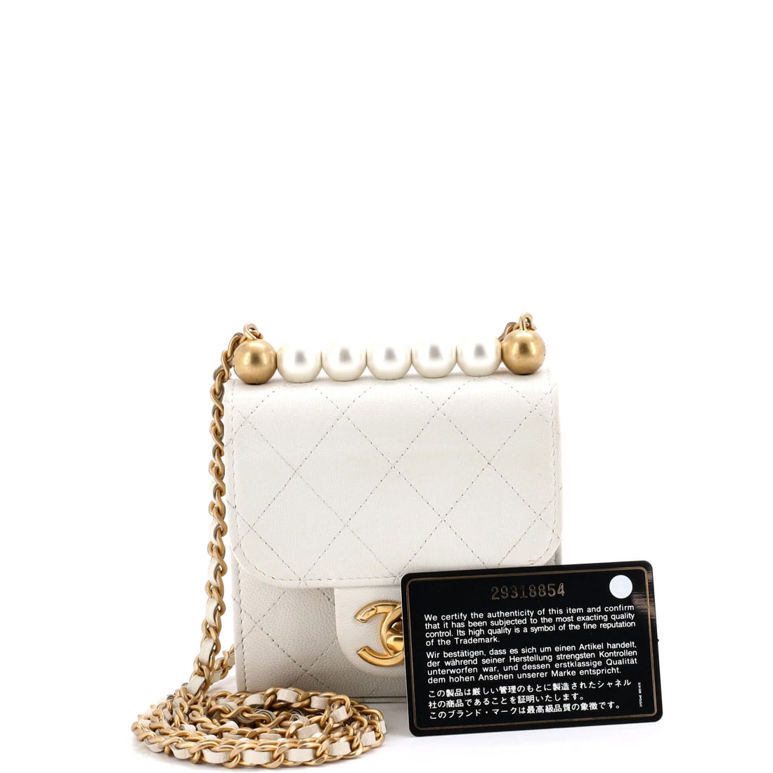 Chanel Chic Pearls Flap Clutch with Chain Quilted Goatskin Mini: Chanel's Chic Flap Clutch with Chain Goatskin leads with disciplined lines and a carry profile built for real use, rendered in quilted leather. Presented in the Mini size for an easy, everyday footpri