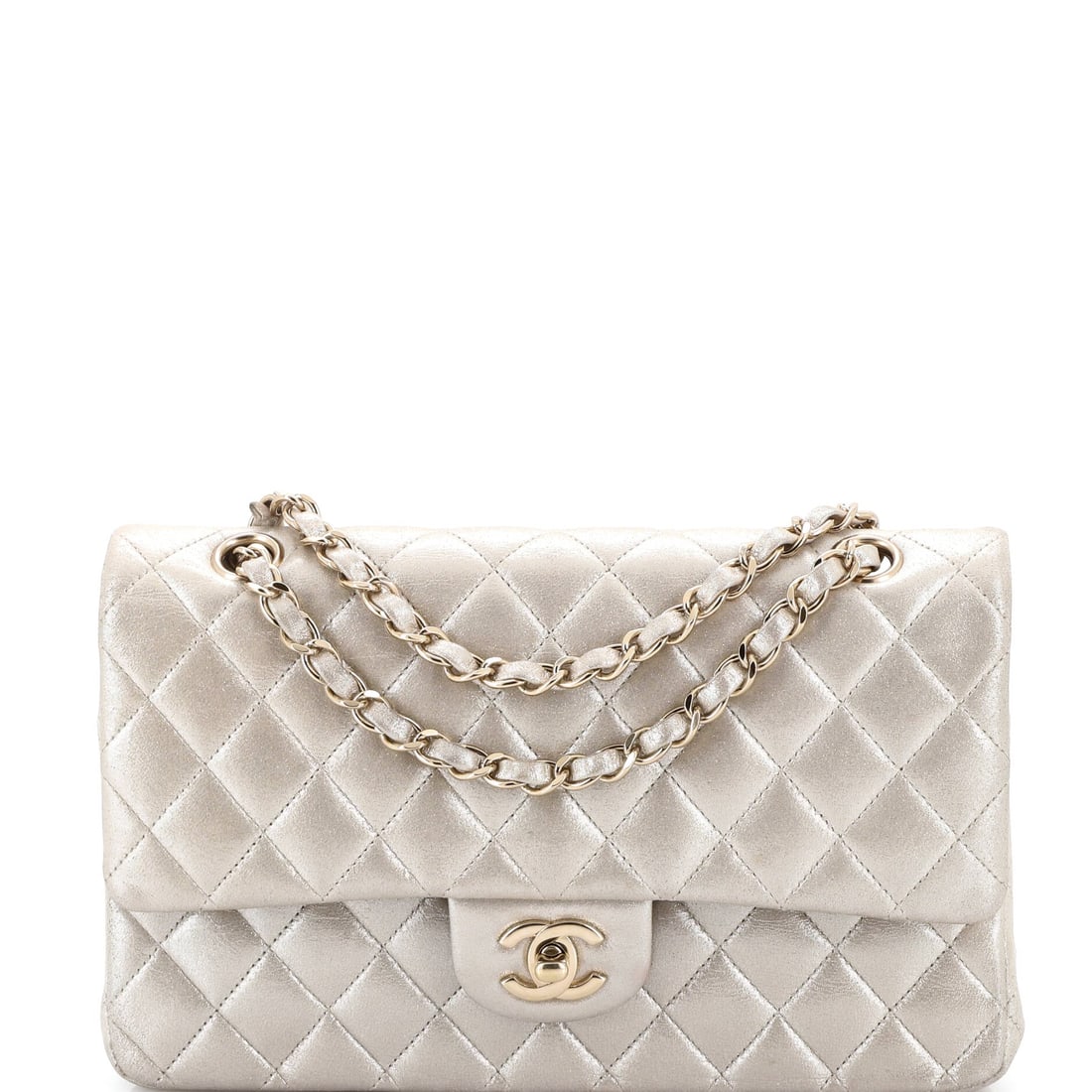 Chanel CC Flap Bag Pearl Studded Quilted Lambskin Medium: Crisp and self-assured, the Chanel CC Flap Bag Studded wears its house identity without raising its voice, rendered in quilted lambskin leather. The Medium format strikes a versatile middle ground in 
