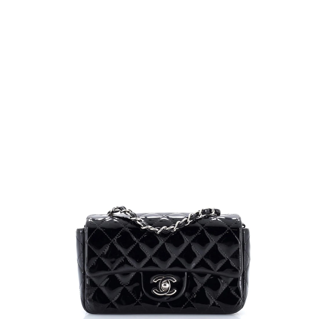 Chanel Classic Double Flap Bag Quilted Patent Jumbo: The Chanel Double Flap Bag opens with the balanced proportion and finish that define the model, rendered in quilted patent. Presented in the Classic size for an easy, everyday footprint. Its measured 