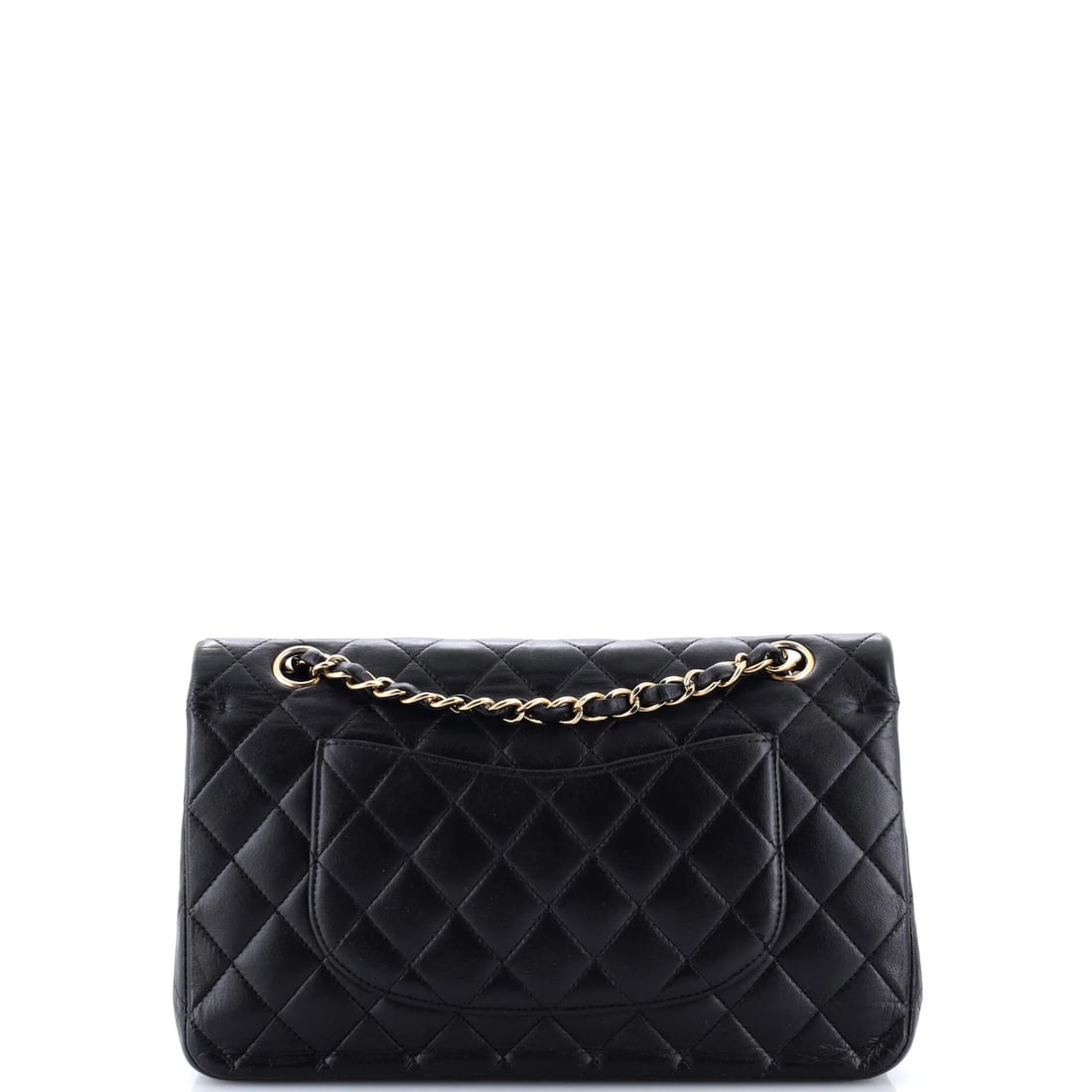 Chanel Vintage Classic Double Flap Bag Quilted Lambskin Medium: The Chanel Vintage Double Flap Bag opens with the balanced proportion and finish that define the model, rendered in quilted lambskin leather. It comes in the Classic size, a scale that places it neatl