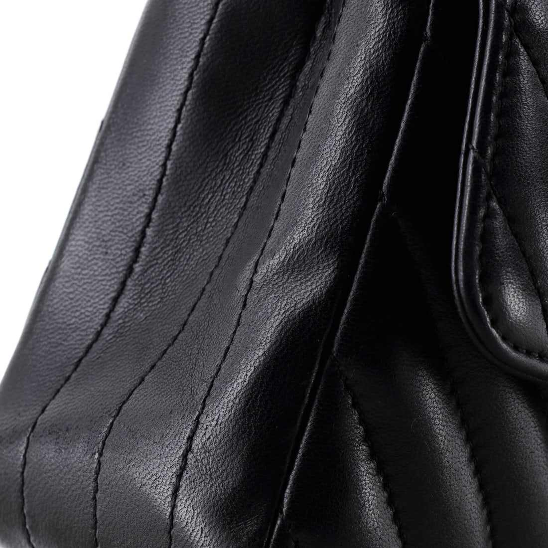 Chanel Classic Single Flap Bag Quilted Patent Mini: The Chanel Single Flap Bag announces itself through clean architecture and a silhouette that reads clearly from across a room, rendered in quilted patent. It comes in the Classic size, a scale that pl