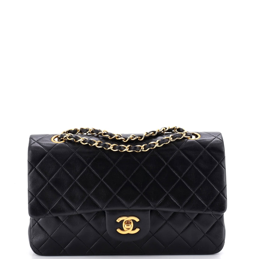 Chanel Vintage Classic Double Flap Bag Quilted Lambskin Medium: The Chanel Vintage Double Flap Bag opens with the balanced proportion and finish that define the model, rendered in quilted lambskin leather. The Classic format strikes a versatile middle ground in th