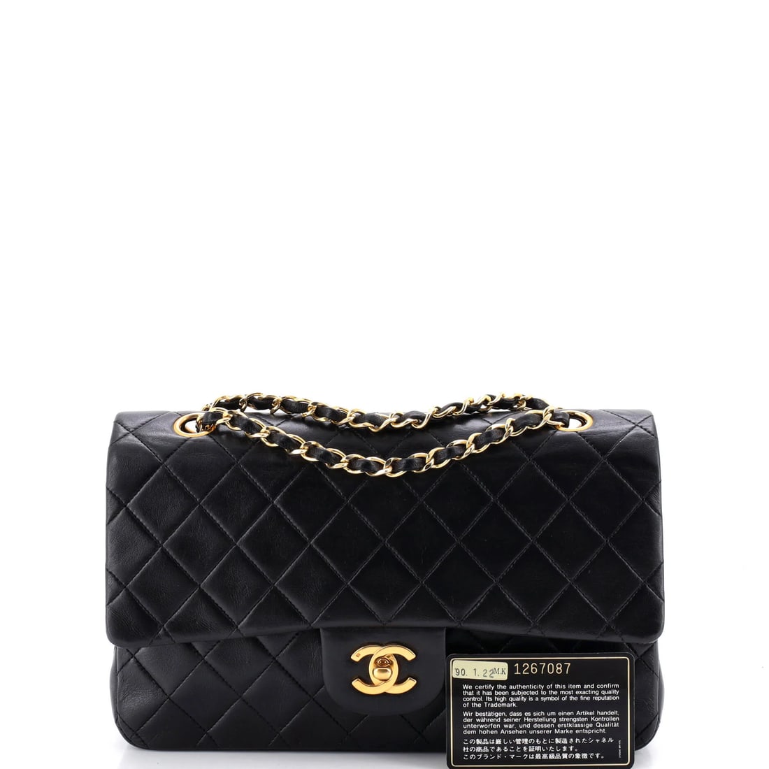 Chanel Vintage Classic Double Flap Bag Quilted Lambskin Medium: The Chanel Vintage Double Flap Bag opens with the balanced proportion and finish that define the model, rendered in quilted lambskin leather. The Classic format strikes a versatile middle ground in th