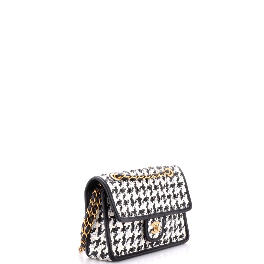 Chanel CC Top Handle Flap Bag Tweed and Quilted Aged Calfskin Medium: The Chanel CC Top Handle Flap Bag and Aged carries the unmistakable hand of the house in its proportion and finish, rendered in quilted calfskin leather and tweed. It comes in the Medium size, a scale