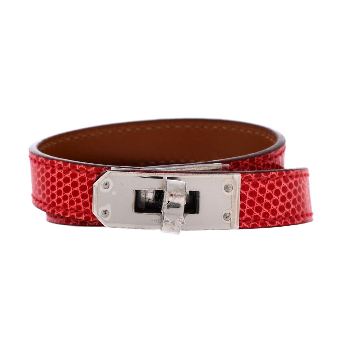 Hermes Kelly Double Tour Bracelet Lizard: Hermes Kelly Double Tour Bracelet in lizard. Borrows the Kelly's turn-lock language, scaled down with the same clean, saddlery-rooted lines. A wrist piece built to be worn, not just stored. The condit