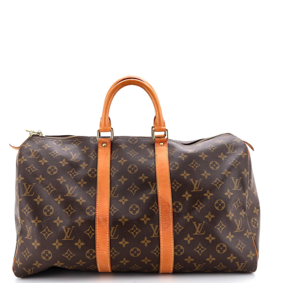 Louis Vuitton Keepall Bag Monogram Canvas: Louis Vuitton's Keepall Bag in Monogram canvas. The rounded ends and double-zip top give it the easy, broken-in look the line is known for. It measures 18"W x 10"H x 8"D, 4" handle drop and 5" strap d