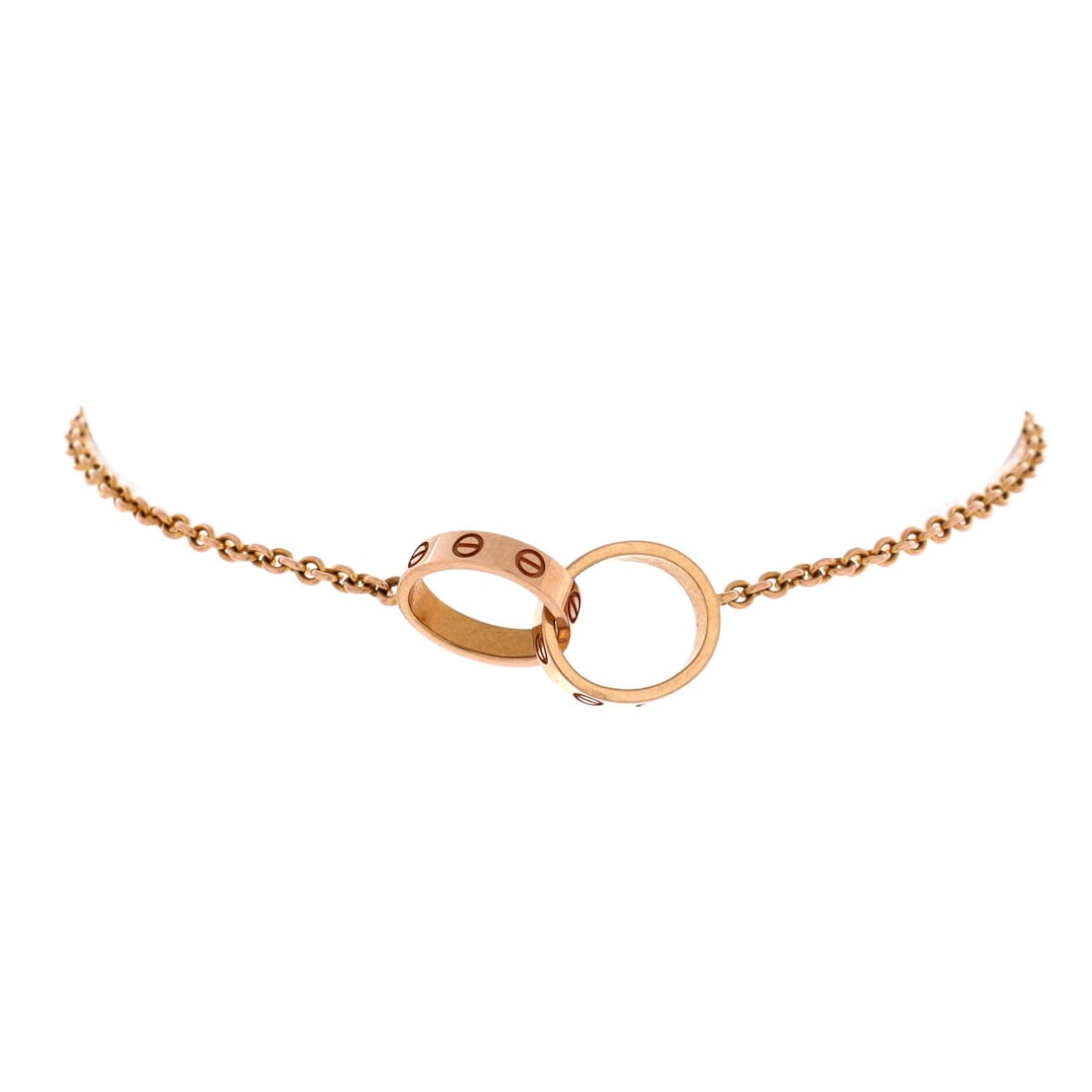 Cartier Love Interlocking Bracelet 18K Rose Gold: Cartier Love Interlocking Bracelet, cut in 18K rose gold. Linked rounds in the Love idiom, screw detailing tying the forms together. Secure on the wrist and easy to layer or wear solo. Comes in Grade 