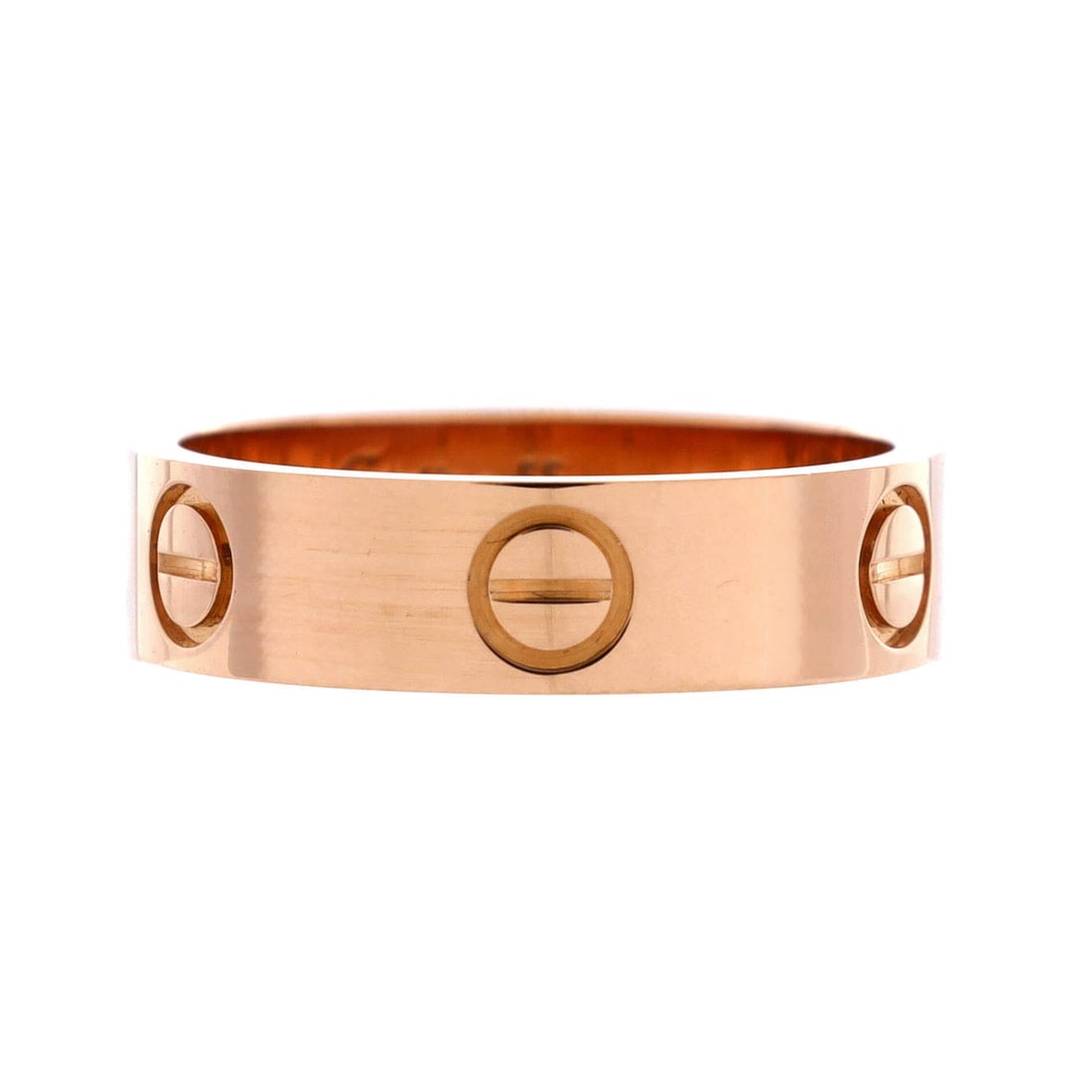 Cartier Love Band Ring 18K Rose Gold: 18K rose gold defines this Cartier Love Band Ring. A medium-width Love band, screw-motif running the full circumference for that instantly readable Cartier line. A wearable Cartier piece at everyday s