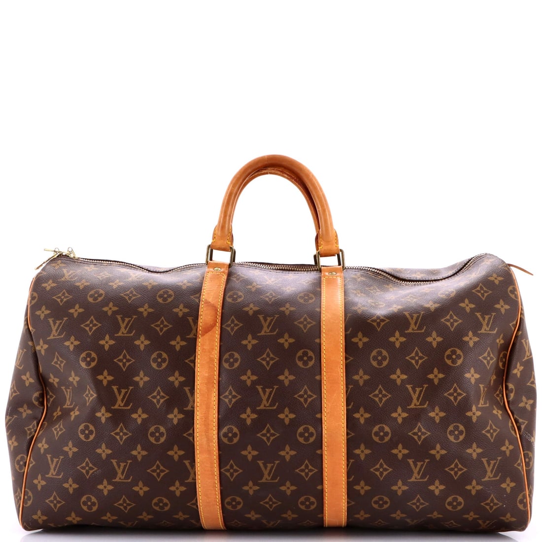 Louis Vuitton Keepall Bag Monogram Canvas: Louis Vuitton Keepall Bag in Monogram canvas. A soft-sided weekender that has defined house travel bags for generations, sized for a short trip without bulk. At 22"W x 12"H x 9"D, 4" handle drop and 2