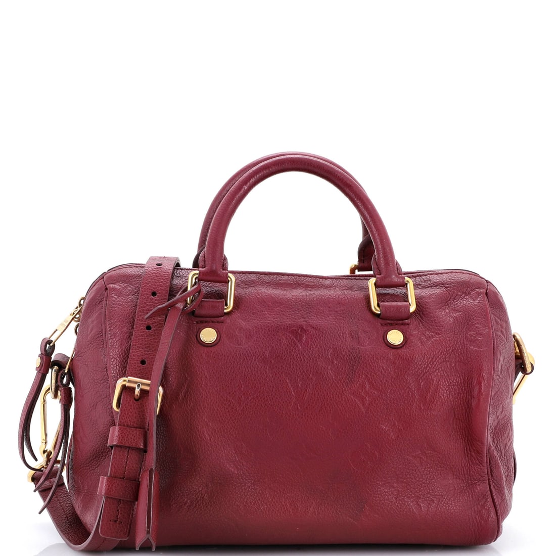 Louis Vuitton Speedy Bandouliere Bag Monogram Empreinte Leather: Louis Vuitton Speedy Bandouliere Bag, cut in Monogram Empreinte leather. Rounded, top-zip and now strap-ready, it covers errands and travel in one shape. 10"W x 7.5"H x 6"D, 2.5" handle drop and 21" s