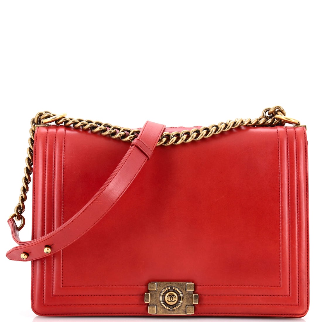 Chanel Reverso Boy Flap Bag Glazed Calfskin: Chanel Reverso Boy Flap Bag, glazed calfskin. The boyish rectangular hardware and structured flap give it a tougher edge than the classic flaps. It carries at 11.5"W x 7.5"H x 3"D, 11" handle drop and