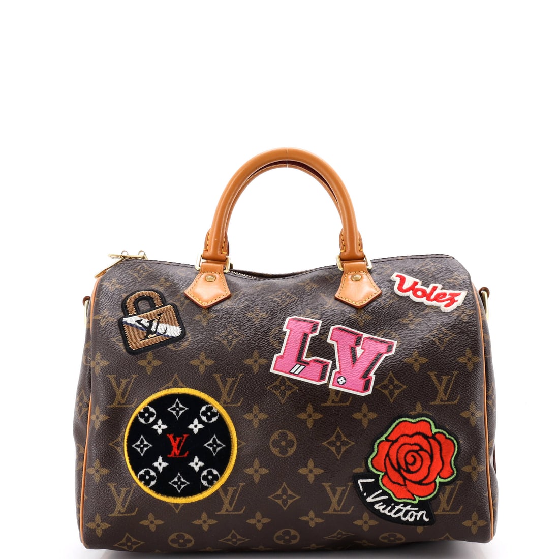Louis Vuitton Speedy Bandouliere Bag Limited Edition Patches Monogram Canvas: Here, the Louis Vuitton Speedy Bandouliere Bag. Rounded, top-zip and now strap-ready, it covers errands and travel in one shape. Sized at 12"W x 8"H x 6.5"D, 3" handle drop and 20" strap drop.