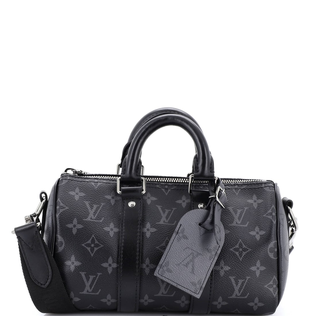 Louis Vuitton Keepall Bandouliere Bag Reverse Monogram Eclipse Canvas: Louis Vuitton's Keepall Bandouliere Bag in reverse Monogram Eclipse canvas. Soft-sided and strap-ready, it folds down between trips and holds its line when packed. Measurements run 9.5"W x 6"H x 4.5"D