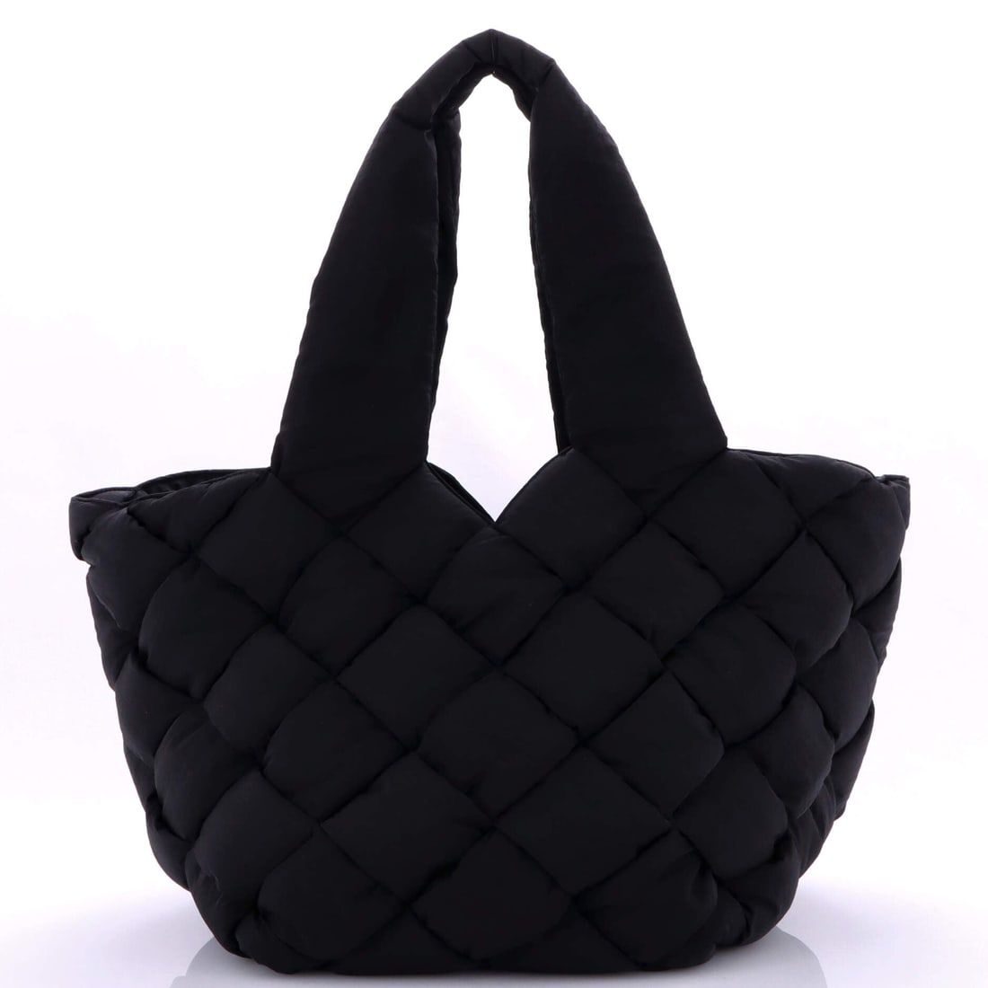 Bottega Veneta Cassette Paper Tote Intrecciato Nylon: Intrecciato nylon defines this Bottega Veneta Cassette Paper Tote. The quilted-weave panels and slim strap make it one of the most recognizable shapes Bottega makes today. Footprint is 10"W x 11"H x 1
