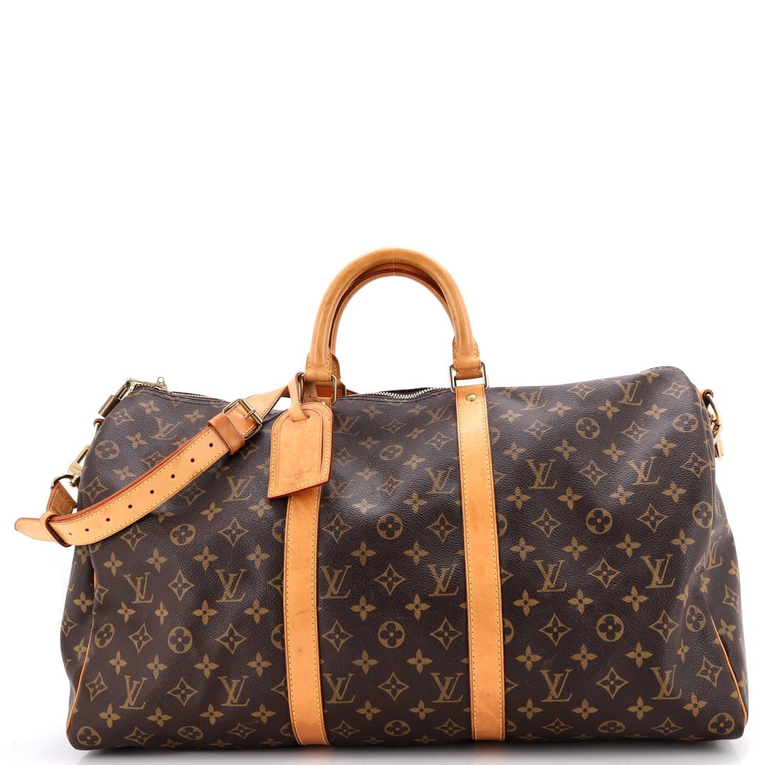 Louis Vuitton Keepall Bandouliere Bag Monogram Canvas: Louis Vuitton Keepall Bandouliere Bag in Monogram canvas. The detachable strap is the difference here, freeing the hands for a passport or a coffee. 20"W x 11"H x 9"D, 4.5" handle drop and 20" strap d