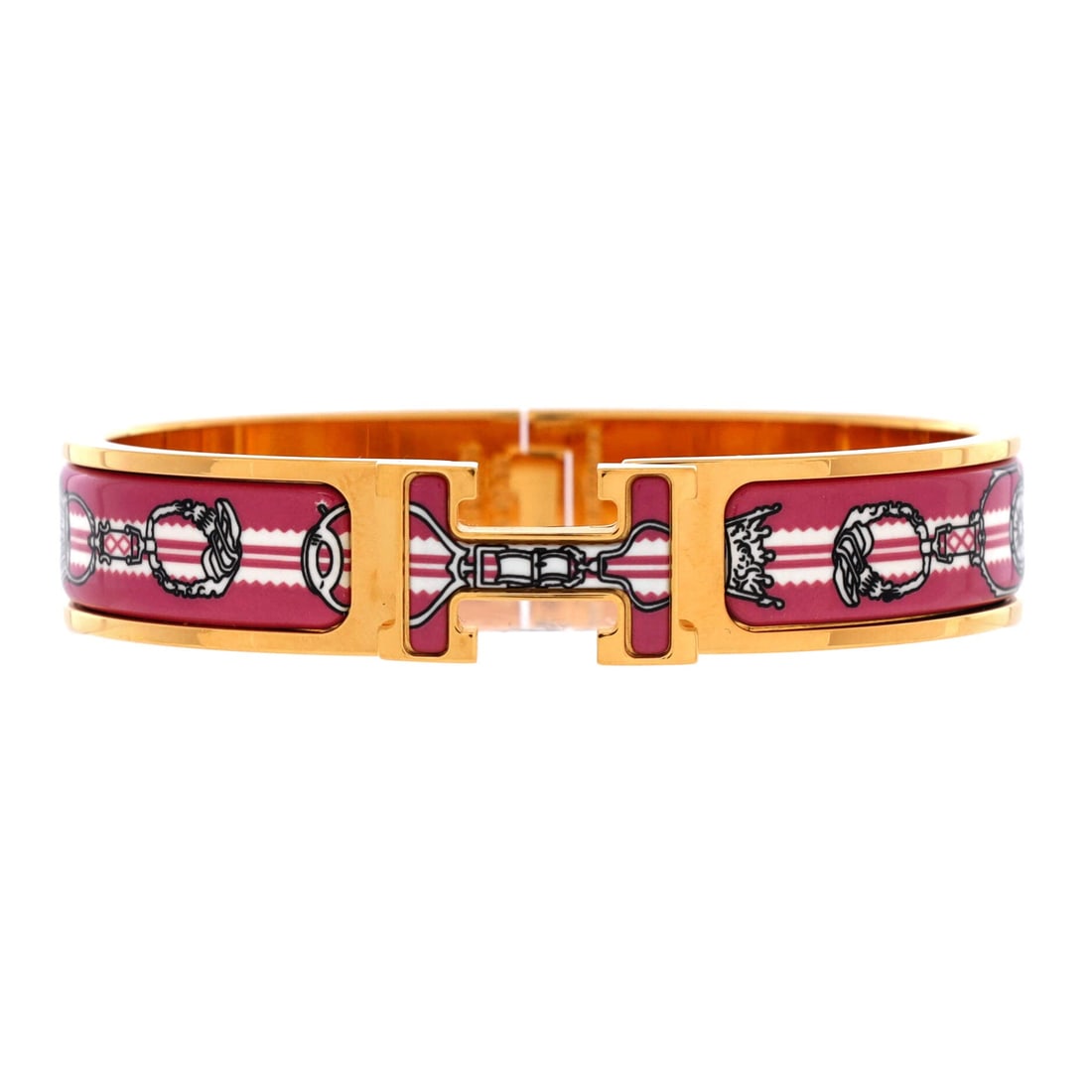 Hermes Clic H Bracelet Printed Enamel: The Clic H Bracelet from Hermes, in printed enamel. An enamel-over-metal bangle with a snap closure and printed signature, a color piece more than a precious one. Secure on the wrist and easy to layer