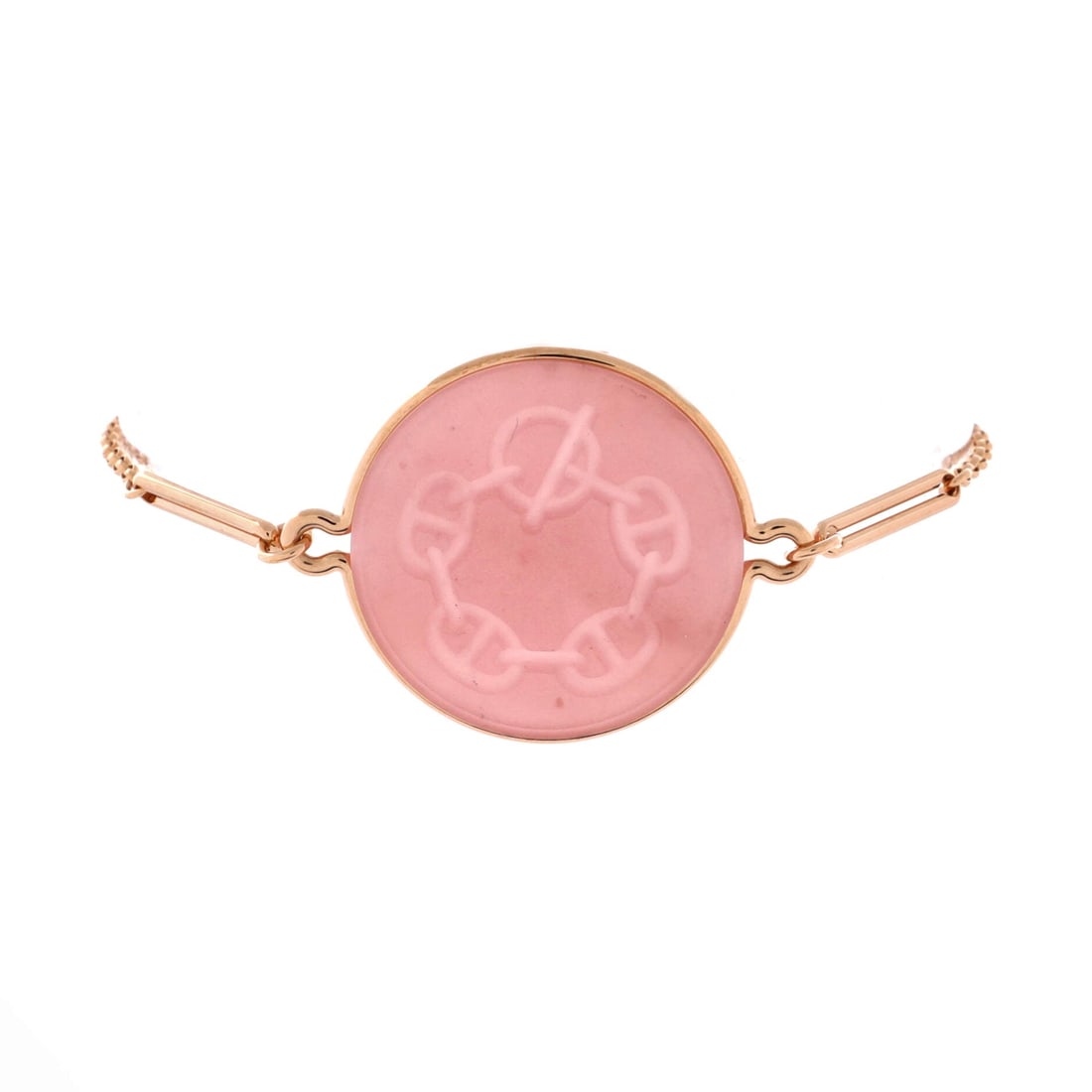Hermes Ex-Libris Bracelet 18K Rose Gold with Pink Chalcedony: The Ex-Libris bracelet cuts the Hermes bookplate motif into 18K rose gold, with pink chalcedony filling the openwork in a soft, slightly milky stone. In Large it measures 6.25" around, loose enough