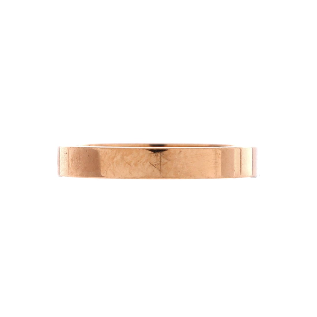 Cartier C de Cartier Wedding Band Ring 18K Rose Gold: Slim at 3.05 mm, this 18K rose gold band carries the C de Cartier motif cut into the surface rather than applied on top of it. That keeps the profile clean enough to wear alongside another ring withou