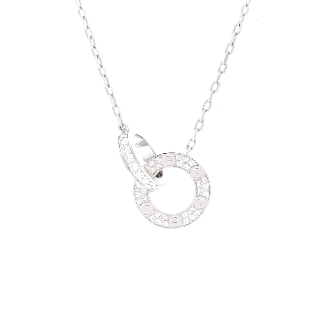 Cartier Love Interlocking Pave Necklace 18K White Gold and Diamonds: Cartier's interlocking Love pendant, fully pave-set, in 18K white gold. The interlocking construction keeps the pendant facing forward on the chain. The chain adjusts between 15.75 and 17 inches. Pave