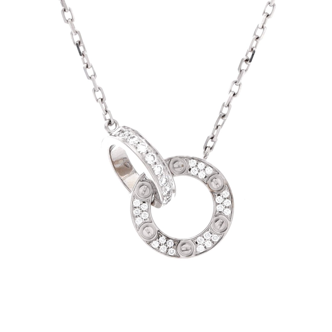 Cartier Love Interlocking Pave Necklace 18K White Gold and Diamonds: This example of the Love interlocking pave necklace is made in 18K white gold. The interlocking construction keeps the pendant facing forward on the chain. The chain adjusts between 14.75 and 16 inche