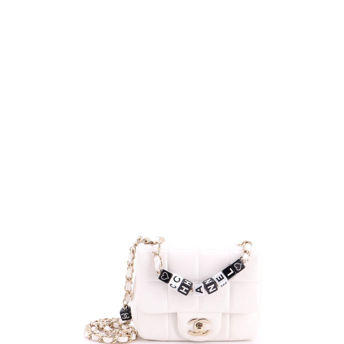 Chanel Monacoco Logo Blocks Square Flap Bag Quilted Lambskin with Resin: This Monacoco square flap in quilted lambskin with resin uses applied logo blocks as its front detail. Block lettering is applied as hardware, so it stands off the quilting rather than printing into i