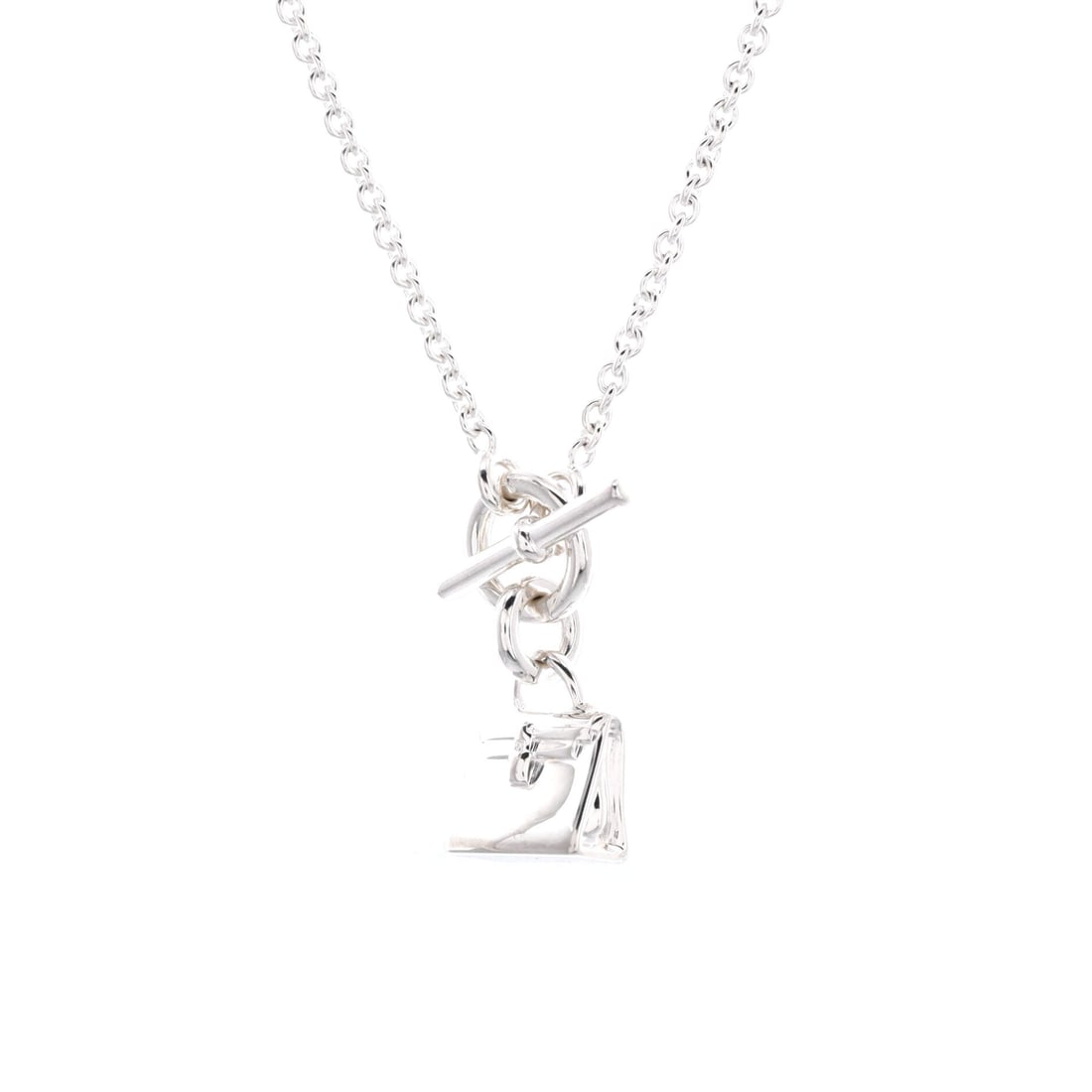 Hermes Kelly Amulette Pendant Necklace Sterling Silver: Scale is what the Amulette line gets followed for, and the Kelly version condenses one of Hermes' best-known bag silhouettes into a pendant. Sterling silver keeps it bright and light on a 16 in long c