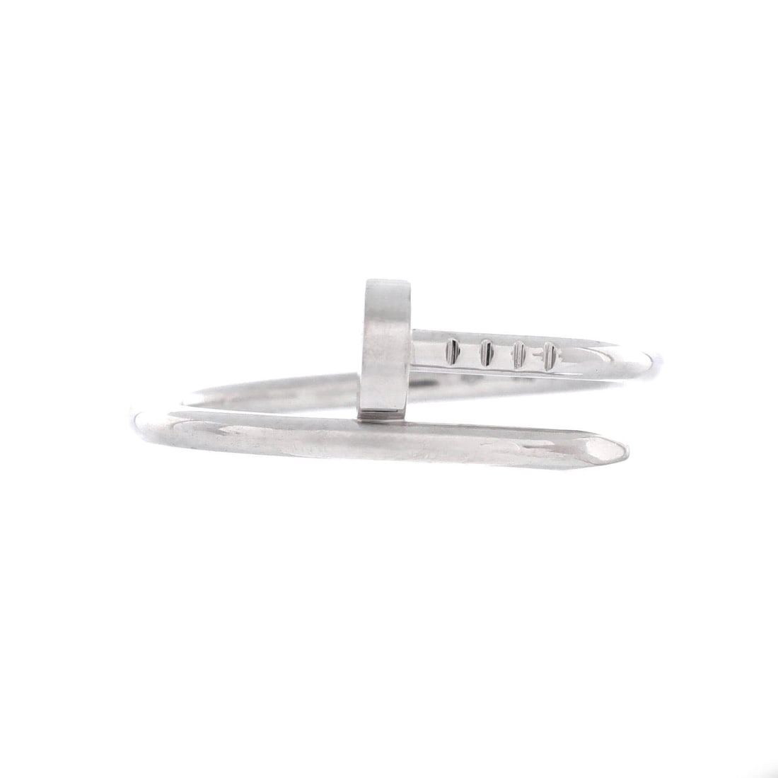 Cartier Juste un Clou Ring 18K White Gold: Cartier built the Juste un Clou on a single gesture, a nail bent into a closed circle with head and tip meeting on top of the finger. In 18K white gold the motif tracks as a drawn line across the hand