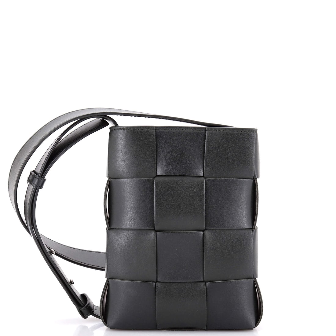 Bottega Veneta Cassette Phone Holder Crossbody Bag Maxi Intrecciato Leather: Cassette Phone Holder is the narrowest reading of Bottega's padded silhouette, sized around a phone, a card and a key. Maxi Intrecciato at this scale means fewer and fatter leather strips, so the weav