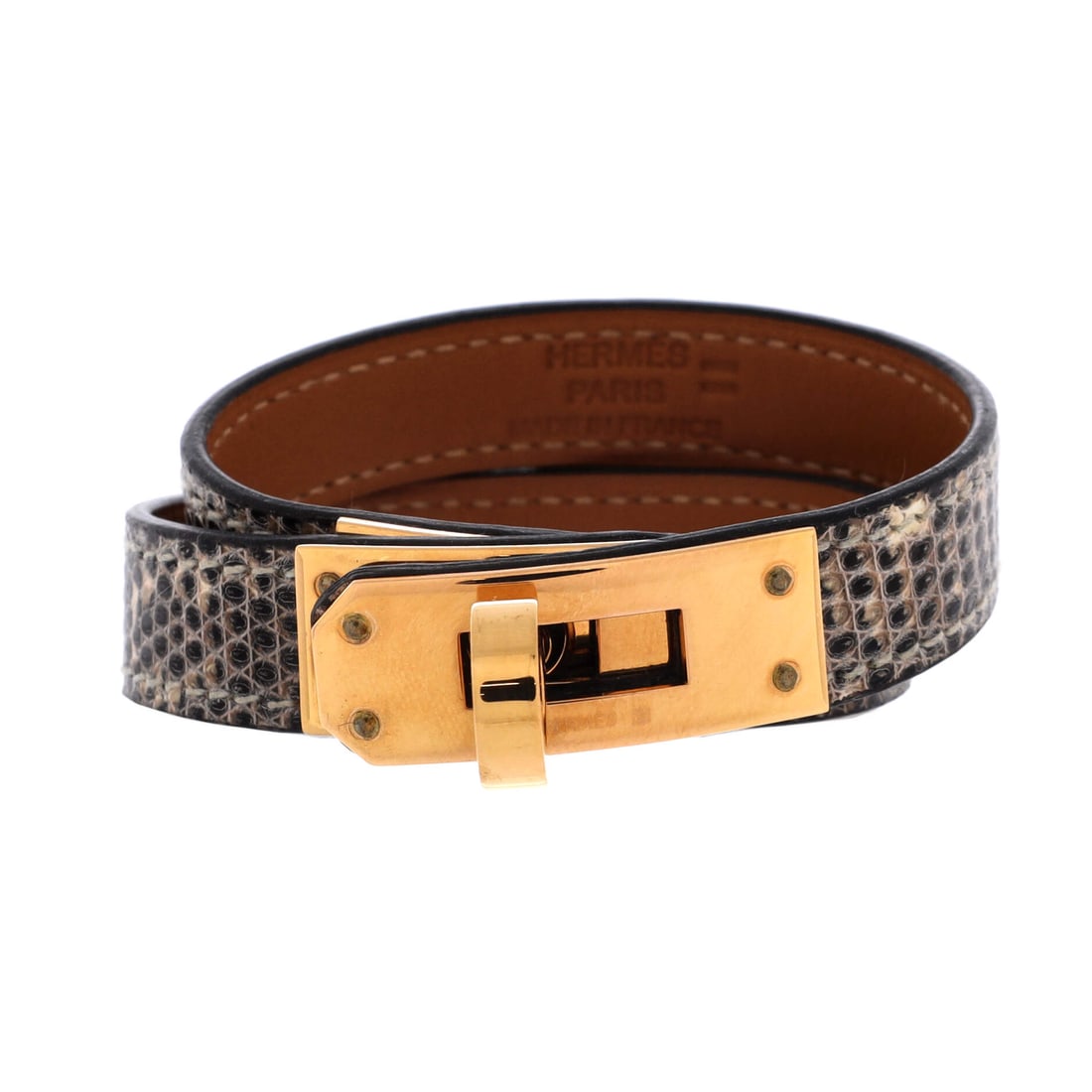 Hermes Kelly Double Tour Bracelet Lizard: Lizard scales break the light into small facets, so this Kelly Double Tour sits closer to jewelry than to a plain leather strap. The band runs 13 mm wide and wraps the wrist twice, closed by the Kelly