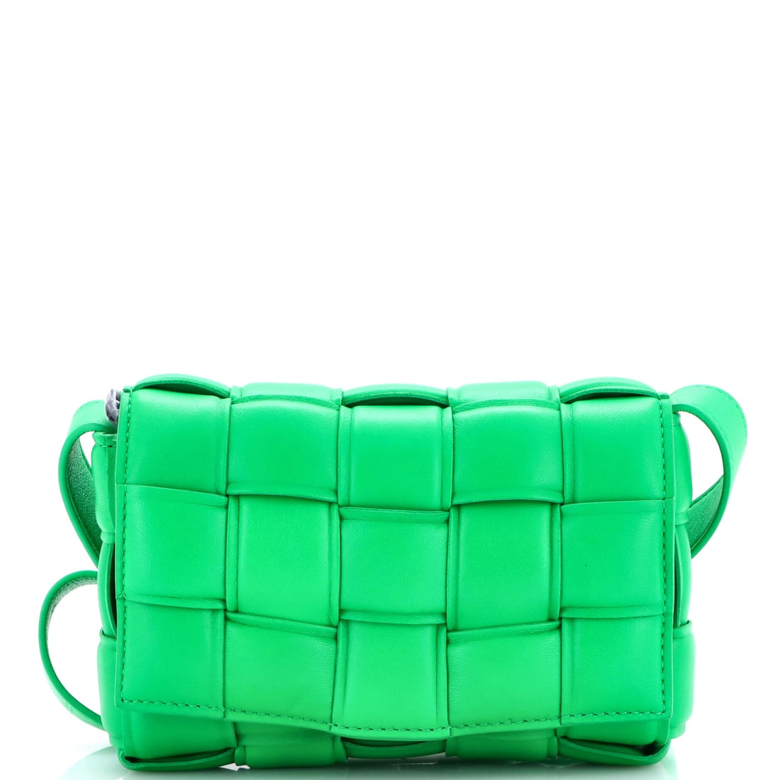 Bottega Veneta Cassette Crossbody Bag Padded Maxi Intrecciato Leather: This Cassette carries the maxi Intrecciato at its most sculptural, bands so thick that the weave becomes the structure and not a surface treatment. Small in the hand at 7.5 in wide x 5 in high x 2 in 