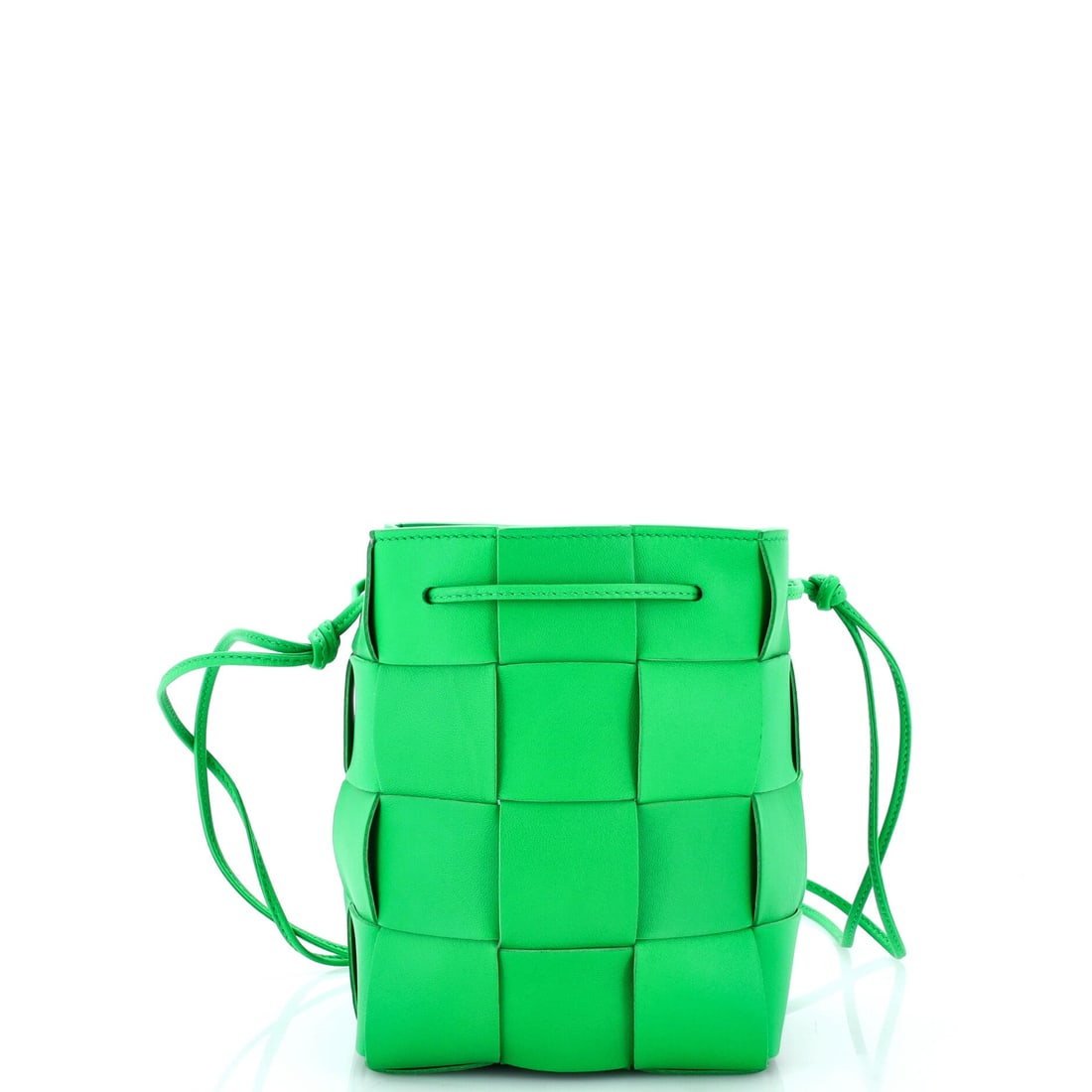 Bottega Veneta Cassette Bucket Bag Maxi Intrecciato Leather: Round where the standard Cassette is rectangular, this bucket version stacks its volume upward instead of across. Narrow at 5.5 in wide and 5.5 in deep with 7 in of height, it holds a phone, cards and