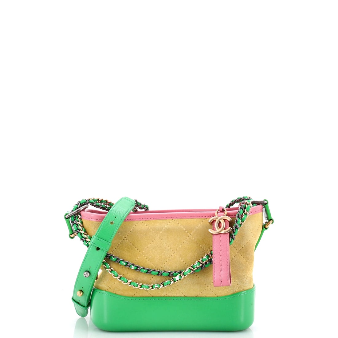 Chanel Gabrielle Hobo Quilted Suede: Gabrielle in quilted suede trades the shine of the calfskin versions for a napped surface that turns the diamond quilting matte. Its hobo body slumps forward while the base stays firm, the tension the