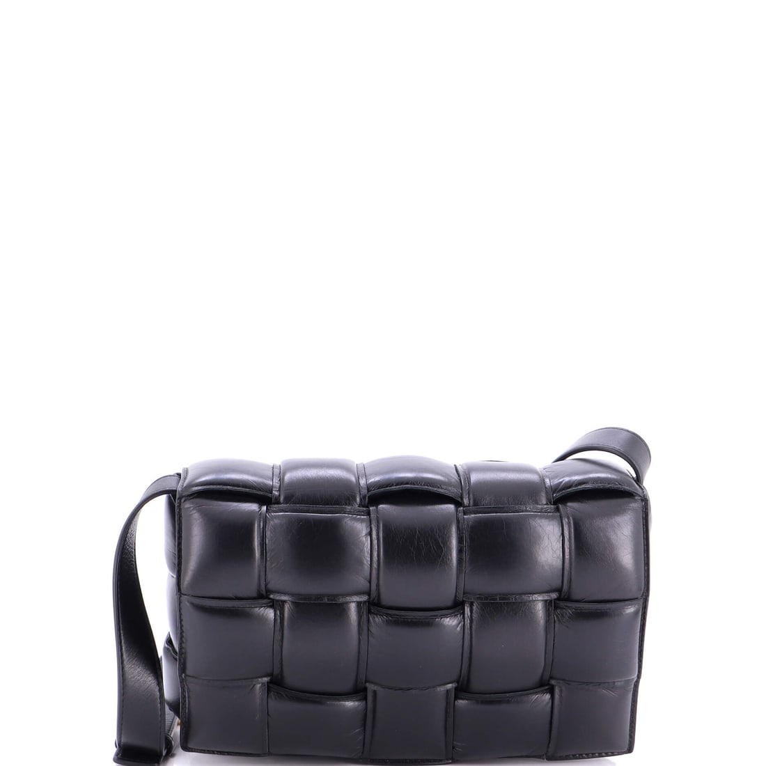 Bottega Veneta Cassette Crossbody Bag Padded Maxi Intrecciato Leather: Leather this soft takes a hand quickly, and the maxi braid spreads the give so the bag looks full even when it is not. Body measurements put it at 9.5 in wide and 7 in high with 3 in of depth, squarel