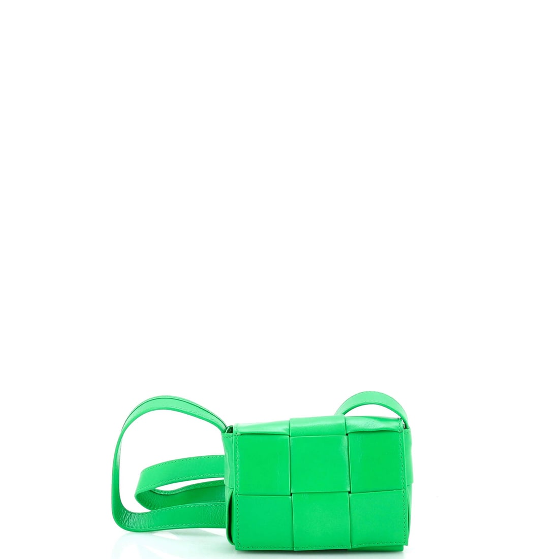 Bottega Veneta Cassette Crossbody Bag Maxi Intrecciato Leather: A fold-over flap does all the closing on a mini Cassette, dropping over the front so the opening never interrupts the woven line. Scale sits at 5 in wide and 3.5 in high on a 1.5 in depth, hung from