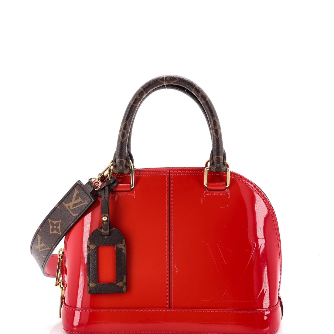 Louis Vuitton Alma Handbag Vernis with Monogram Canvas: Alma's dome sits on a structured base with a double zip running the length of the top, which is why the outline holds even half full. Vernis lays a lacquered sheen against the Monogram canvas it is