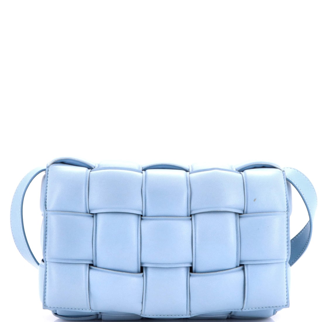 Bottega Veneta Cassette Crossbody Bag Padded Maxi Intrecciato Leather: Pattern comes before material at this scale, the Intrecciato bands broad enough that the eye follows the crossings instead of the leather. The bag itself is slight at 9 in wide, 5 in tall, 2 in deep, 
