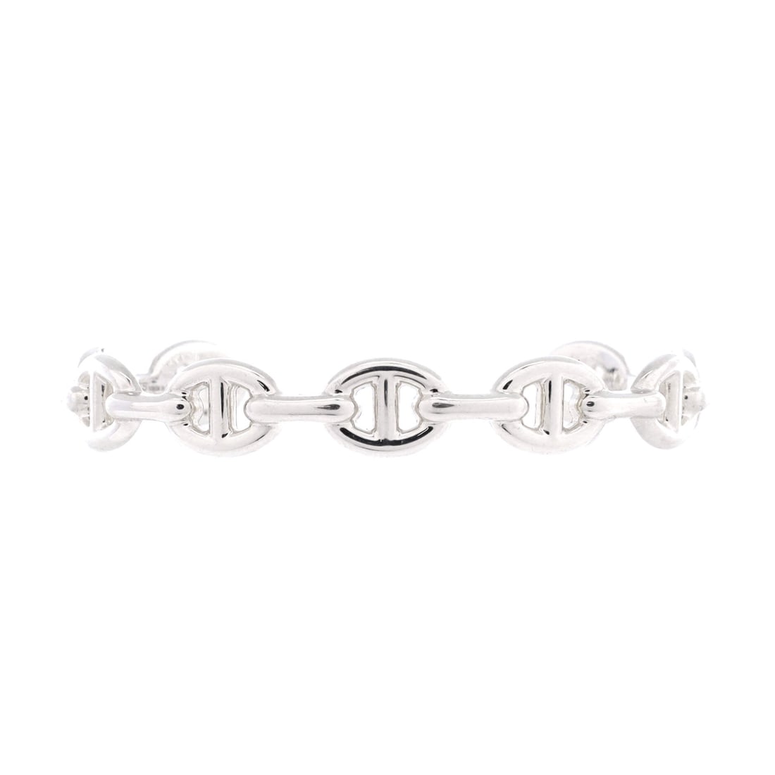 Hermes Chaine d'Ancre Enchainee Cuff Bracelet Sterling Silver: Worn alone, the Enchainee cuff carries all the pattern it needs, the anchor links registering as texture from a step back and as detail up close. A 10 mm width in sterling puts the piece in daily terr