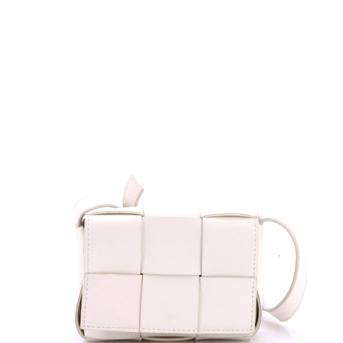 Bottega Veneta Cassette Crossbody Bag Maxi Intrecciato Leather: A mini Cassette makes its case on the strap, which adjusts through 20-24 in and turns a small box into a crossbody. Padded maxi Intrecciato gives the shell backbone at the corners, and the whole
