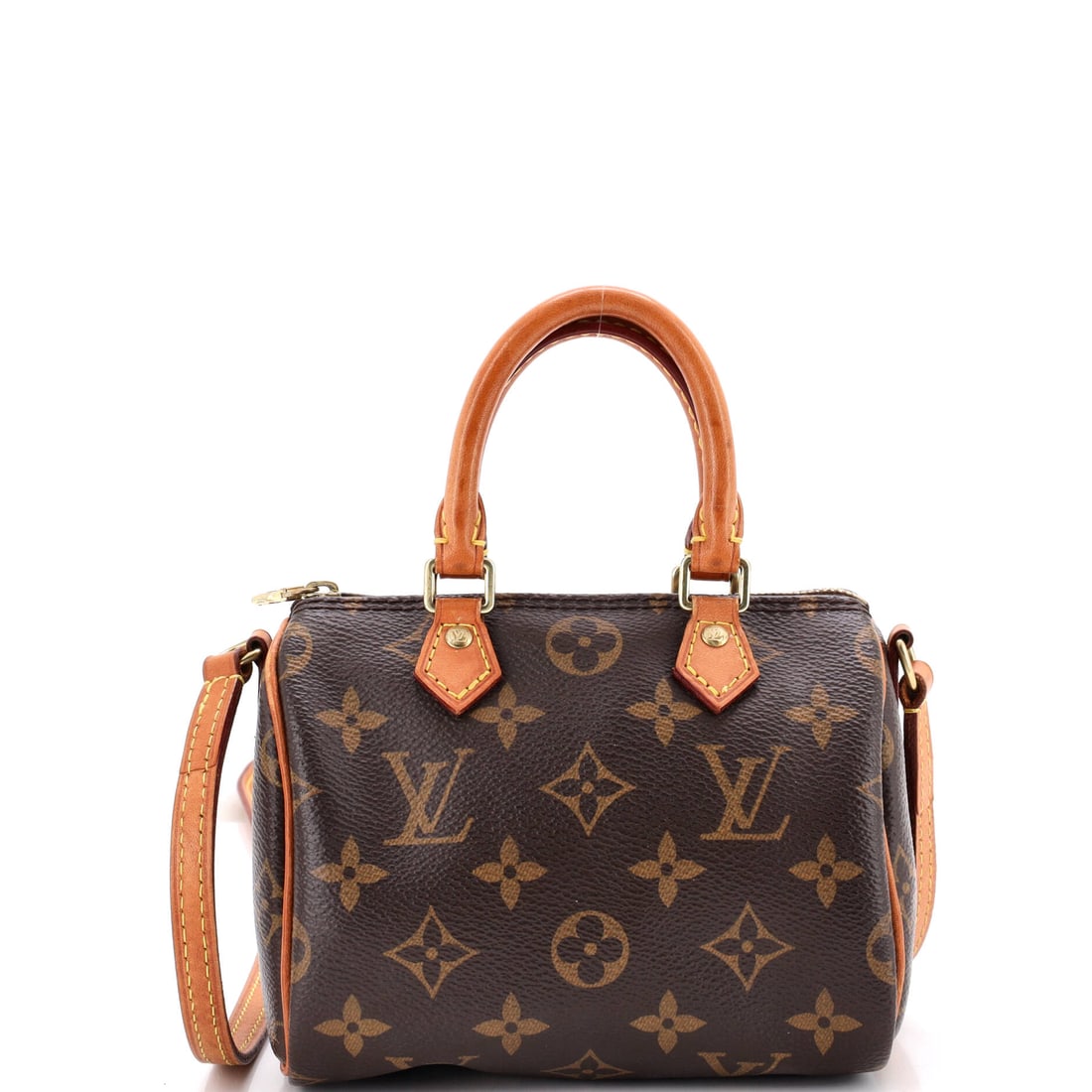 Louis Vuitton Speedy Bandouliere Bag Monogram Canvas: Coated canvas printed with the monogram, cut down to a 6 in wide x 4 in high x 4 in deep body, puts the repeat at a scale where the print almost becomes texture. A 21 in strap drop turns it into a cro