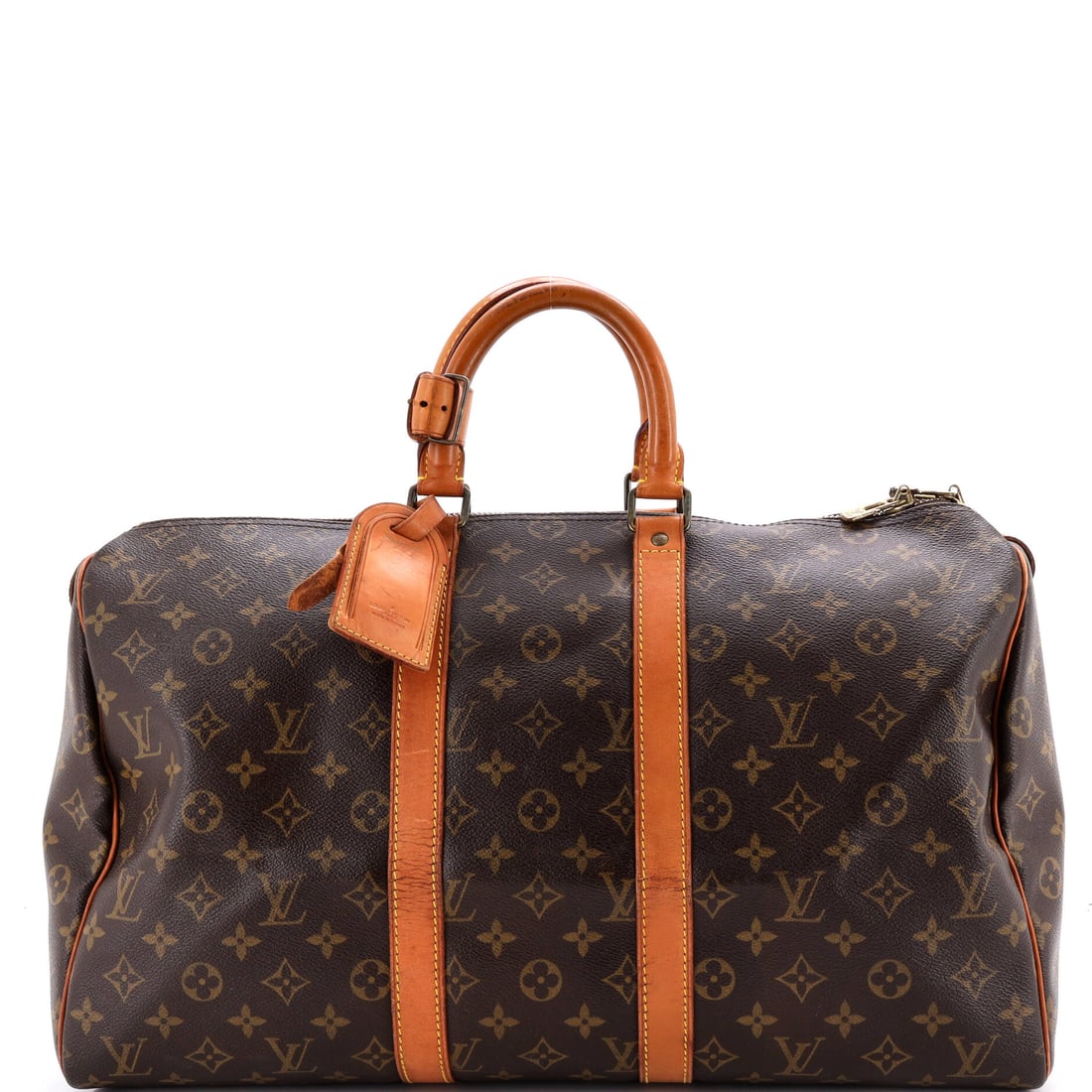 Louis Vuitton Keepall Bag Monogram Canvas: Soft sides and a flat base let this duffel stand when packed and fold away when not, a trick rigid luggage cannot manage. The compact 18 in wide x 10 in high x 8 in deep size carries a night away, and