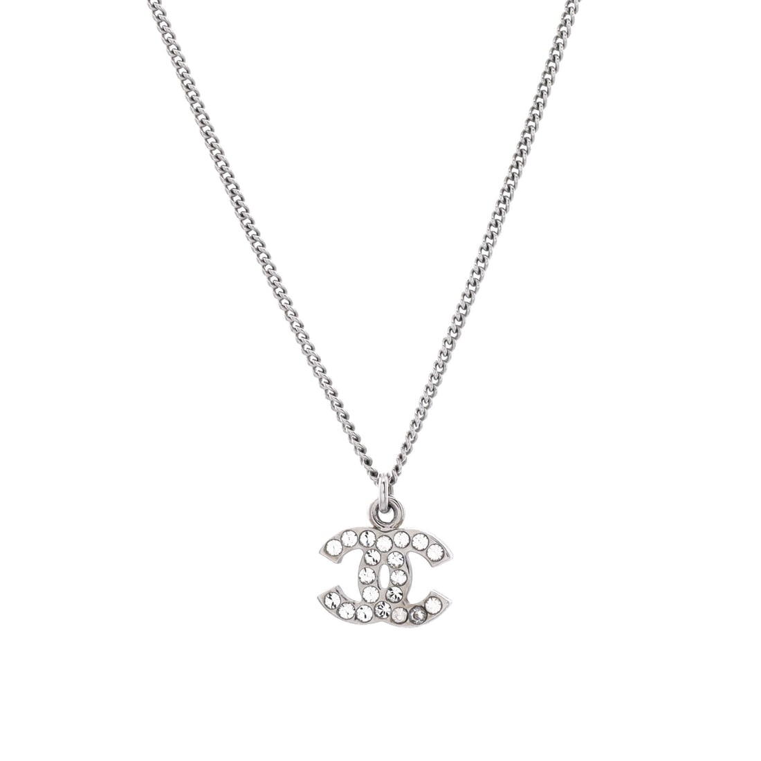 Chanel CC Crystal Logo Necklace Metal: Costume pieces like this one do their work at the collarbone, and a 17 in chain sits high on a crewneck. The CC pendant measures 11 mm wide, compact for a suit and crystal-set so it catches light. Met
