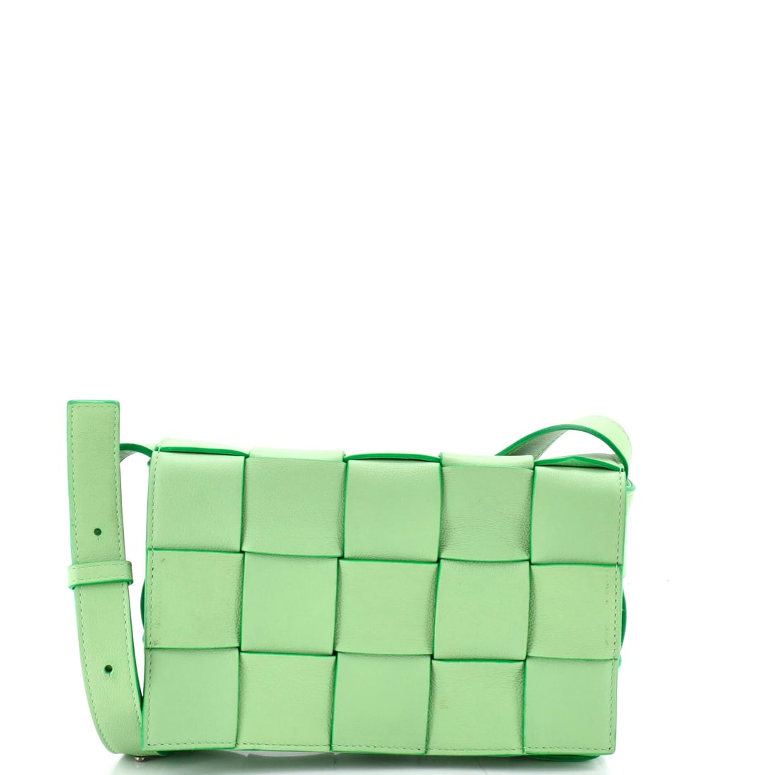 Bottega Veneta Cassette Crossbody Bag Maxi Intrecciato Leather: Woven leather in the widest gauge Bottega cuts wraps a box 9 in wide by 6 in high, on a footprint 2 in deep that still swallows a wallet alongside the phone. An 18-22 in strap range lets it ride at th