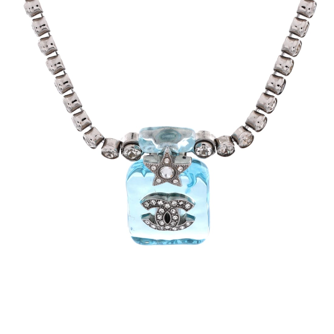Chanel CC Star Perfume Bottle Pendant Necklace Metal with Resin and Crystals: A costume pendant shaped as a miniature perfume bottle, its CC and star motifs held in resin and crystals on a metal chain. At 17 in long the chain settles near the collarbone, and the 1 in wide penda