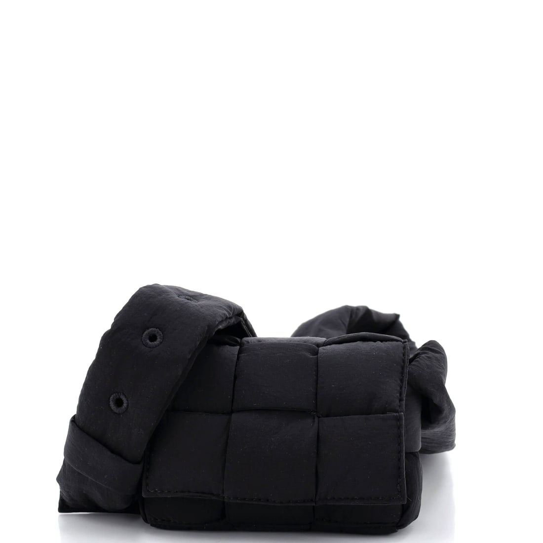 Bottega Veneta Cassette Crossbody Bag Maxi Intrecciato Nylon: Where an evening clutch sits idle most nights, this nylon Cassette does the same job hands-free and survives a walk home in the rain. Nothing about 5 in wide x 3.5 in high x 1.5 in deep pretends to ho