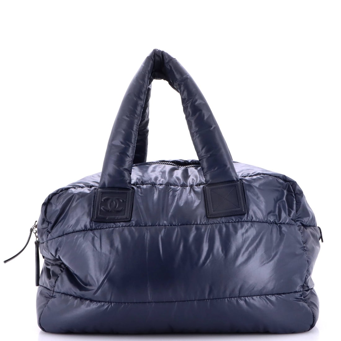 Chanel Coco Cocoon Bowling Bag Quilted Nylon: For a rotation heavy on lambskin, a quilted nylon bag covers the days when weather rules leather out. The bowling shape holds 16.5 in wide, 10 in high and 7 in deep, enough for a laptop sleeve or a gy