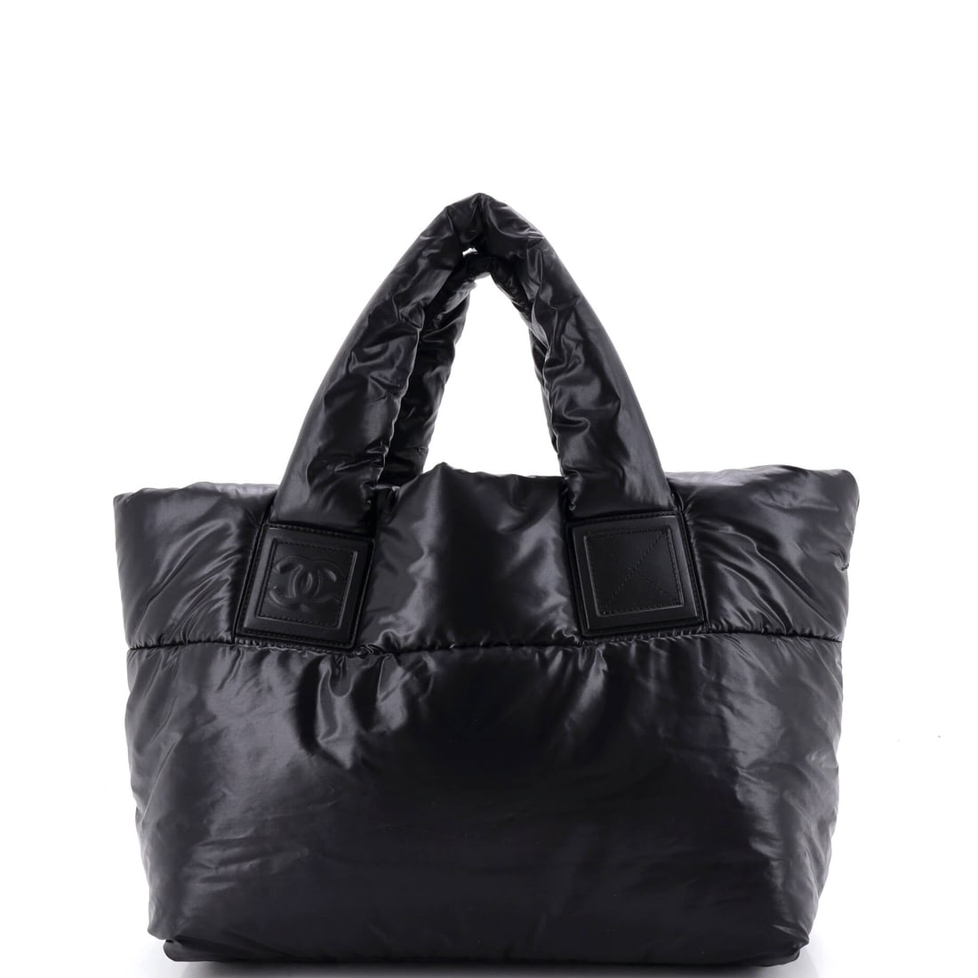 Chanel Coco Cocoon Reversible Tote Quilted Nylon: Reversibility is the trick of this tote, one nylon body that turns inside out to show a different face. Measurements hold at 12 in wide, 9 in high and 6 in deep, with handles dropping 6 in for shoulde