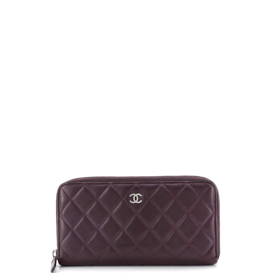 Chanel Zip Around Wallet Quilted Lambskin: Long and low at 8 in wide x 4 in high x 1 in deep, this quilted zip-around slides into a small bag without wedging against the sides. Lambskin gives the quilting a plush, cushioned surface that firmer